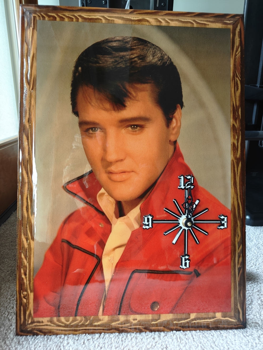 Vintage Elvis Presley wall clock adorned with a portrait of Elvis Presley
